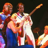 Björn, Frida and Agnetha surrounding guitarist Lasse Wellander during Does Your Mother Know.