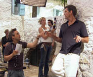 Musical Director Martin Lowe gives instructions to Pierce Brosnan.